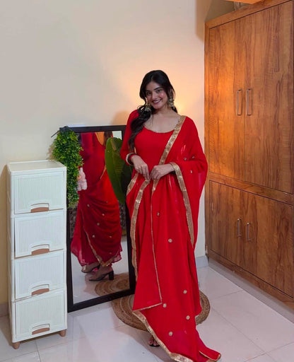 Ruby Red Georgette Saree with Gold Border & Embellished Blouse